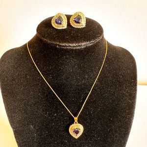 Gold plated necklace and earrings set with zirconia and navy blue stone.